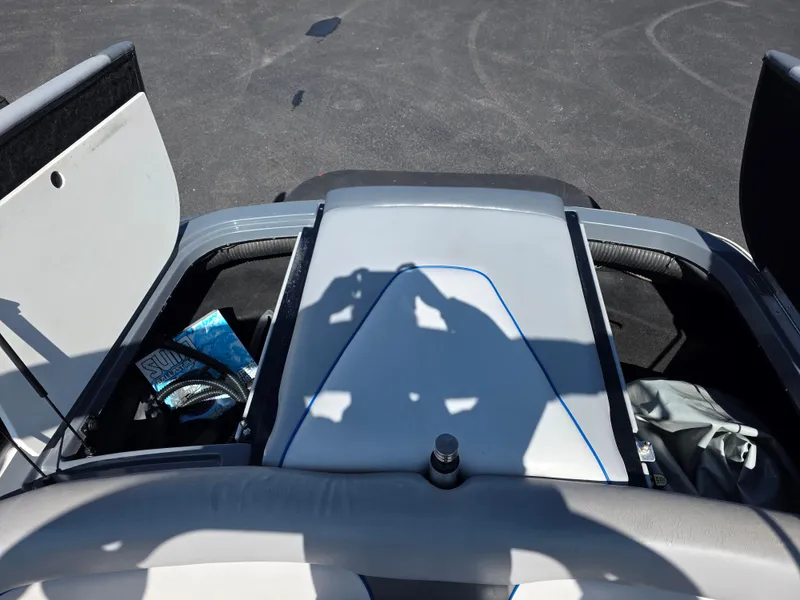 Slide: The Image of 2007 Centurion Boats ENZO23 interior storage compartments with visible gear and accessories. - 12