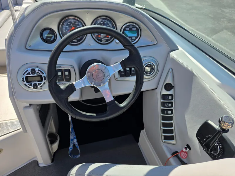 Slide: The Image of 2007 Centurion Boats ENZO23 dashboard with steering wheel and control panel. - 14