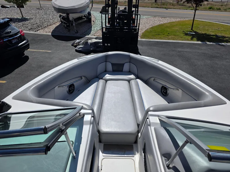 Slide: The Image of 2007 Centurion Boats ENZO23 bow seating area with gray upholstery and speakers. - 15