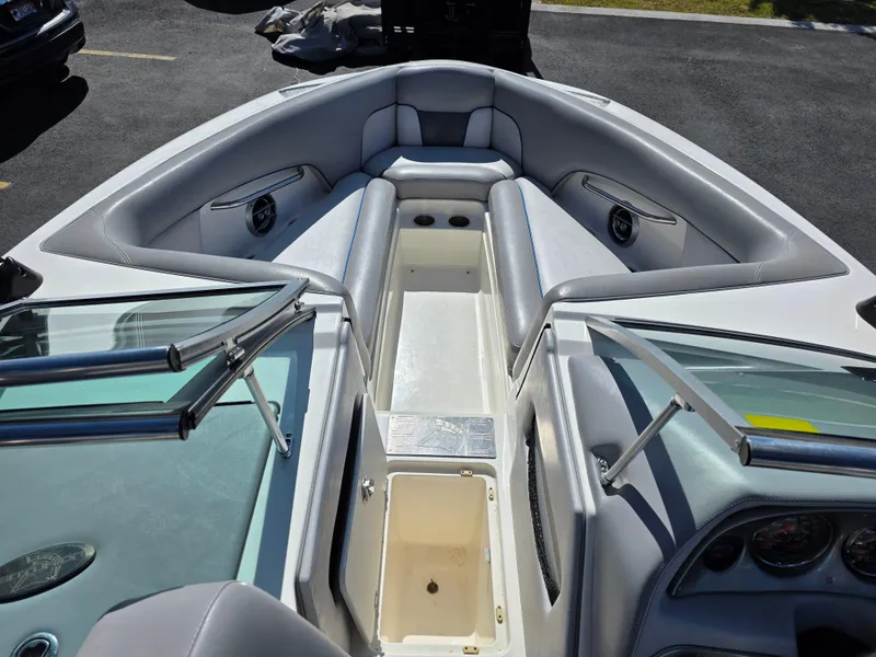 Slide: The Image of 2007 Centurion Boats ENZO23 interior with gray seating and open storage compartment. - 16
