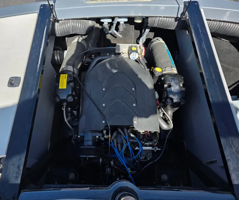 Slide: The Image of Engine compartment of a 2007 Centurion Boats ENZO23, showcasing detailed mechanical components. - 19