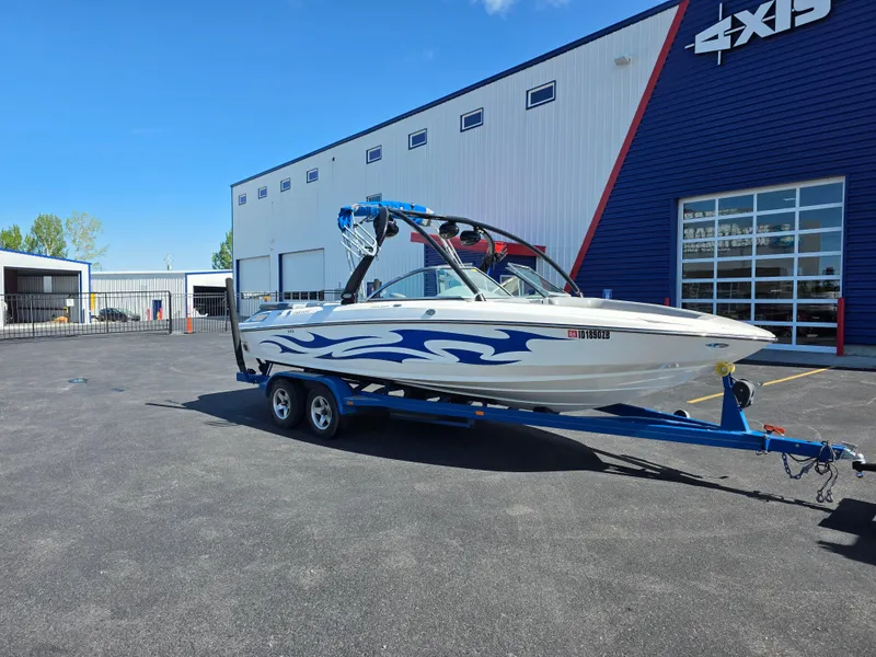 Slide: The Image of 2007 Centurion Boats ENZO23 on trailer, parked outside a dealership. - 3