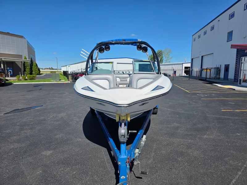 Slide: The Image of 2007 Centurion Boats ENZO23 on trailer in parking lot, clear sky background. - 4