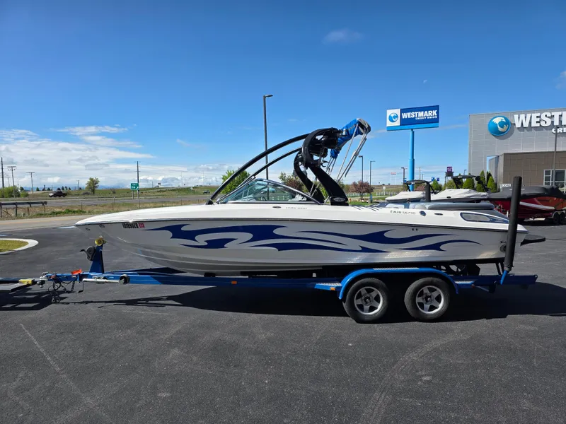 Slide: The Image of 2007 Centurion Boats ENZO23 on trailer, parked outdoors near Westmark Credit Union. - 6