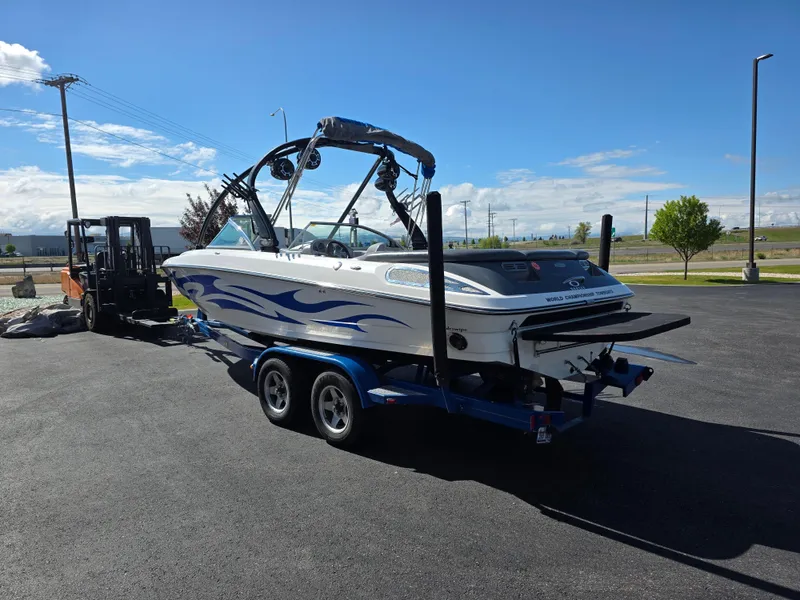 Slide: The Image of 2007 Centurion Boats ENZO23 on trailer, parked outdoors under clear blue sky. - 7