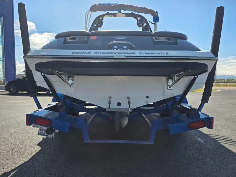 Slide: The Image of 2007 Centurion Boats ENZO23 on trailer, rear view, showcasing "World Championship Towboats" branding. - 8