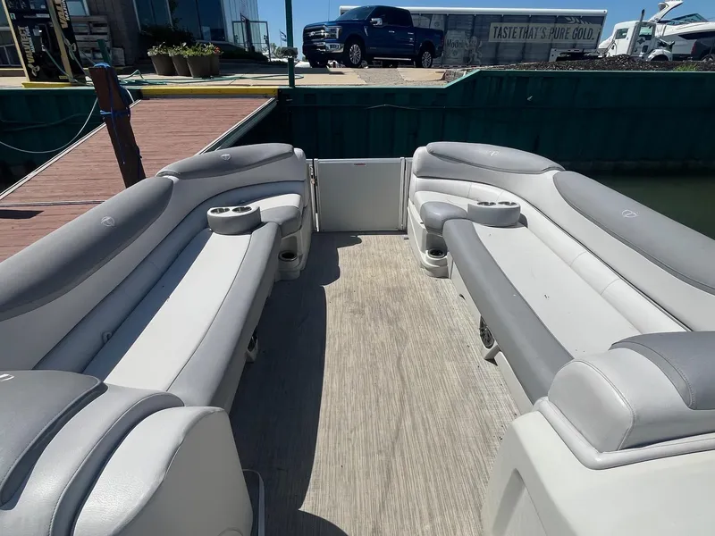 Slide: The Image of 2018 Tahoe Cascade 2585 CR pontoon boat interior with gray seating and cup holders. - 3