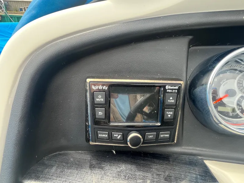 Slide: The Image of Infinity Bluetooth stereo system on 2018 Tahoe Cascade 2585 CR dashboard. - 6