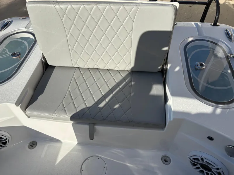Slide: The Image of 2023 Blazer 2700 HYBRID BAY boat seat with diamond-pattern upholstery and storage compartments. - 11