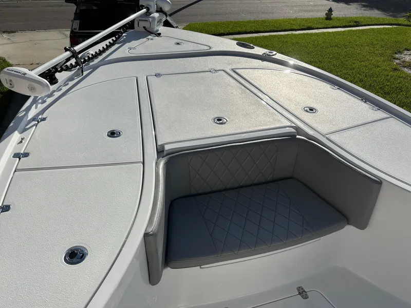 Slide: The Image of 2023 Blazer 2700 HYBRID BAY boat deck with cushioned seating and storage compartments. - 17