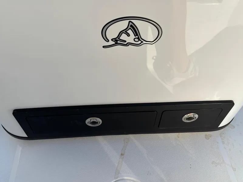 Slide: The Image of 2023 Blazer 2700 HYBRID BAY boat detail with logo and storage compartments. - 19