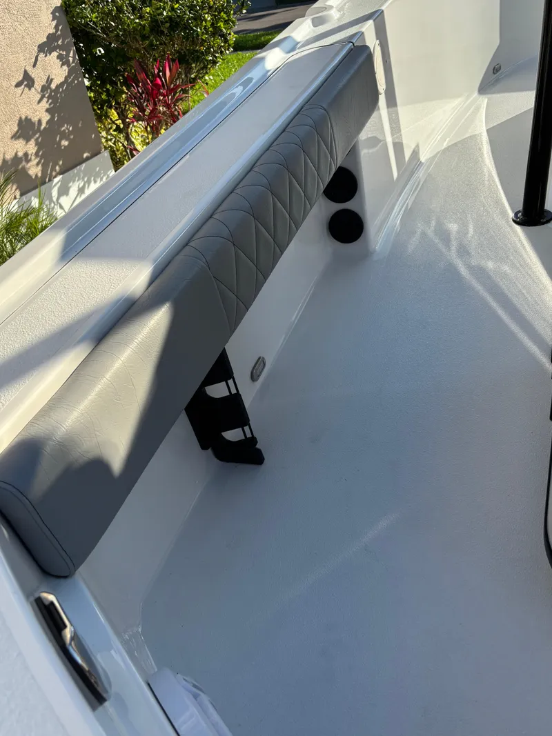 Slide: The Image of 2023 Blazer 2700 HYBRID BAY boat interior with cushioned seating and sleek design. - 25