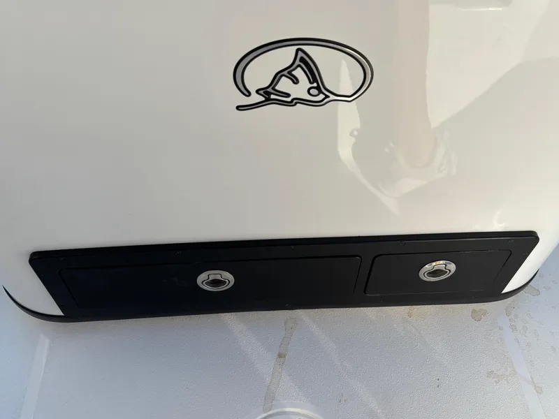 Slide: The Image of 2023 Blazer 2700 HYBRID BAY boat detail with logo and storage compartments. - 27