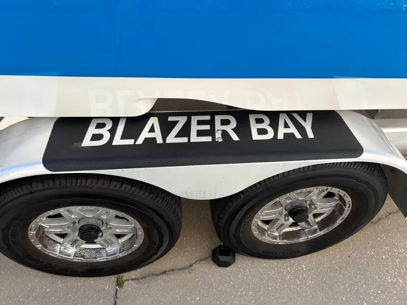 Slide: The Image of 2023 Blazer 2700 HYBRID BAY trailer with dual wheels and "BLAZER BAY" branding. - 6