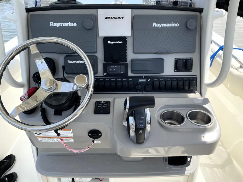 Slide: The Image of Control panel of a 2017 Boston Whaler 230 Outrage boat with Raymarine electronics. - 12