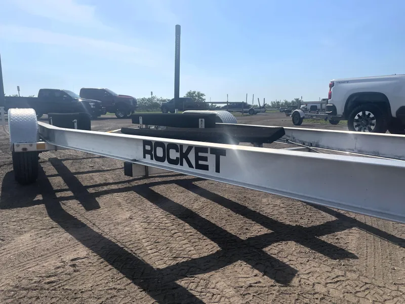 Slide: The Image of Boat trailer labeled "Rocket" for 2017 Boston Whaler 230 Outrage, parked on dirt lot. - 19