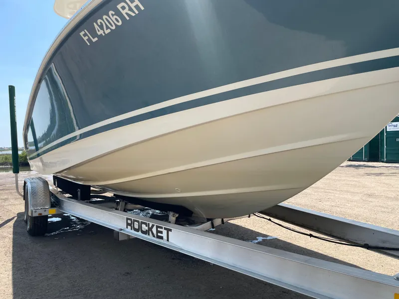 Slide: The Image of 2017 Boston Whaler 230 Outrage on a Rocket trailer, side view. - 7
