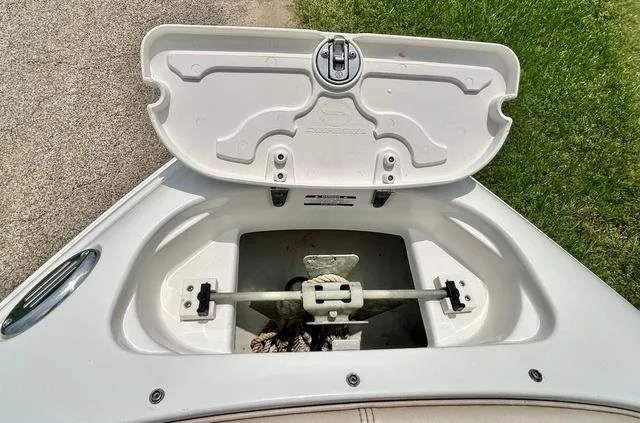 Slide: The Image of Open anchor storage compartment on a 2006 Chaparral 204 SSi boat. - 11
