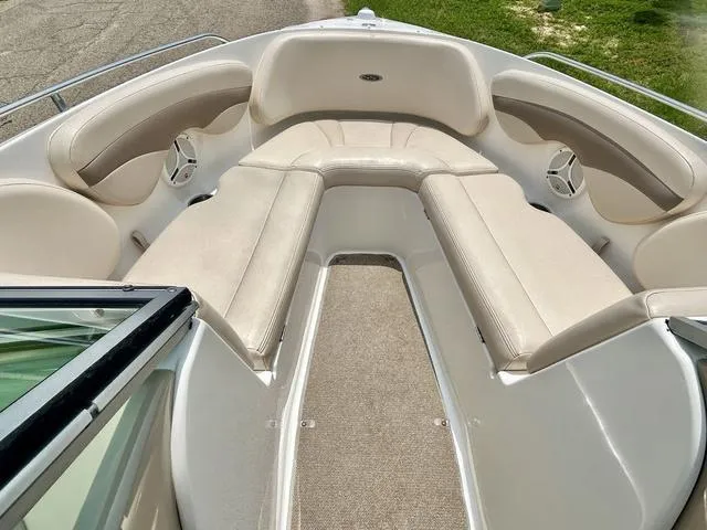 Slide: The Image of 2006 Chaparral 204 SSi boat interior with beige seating and carpeted floor. - 12