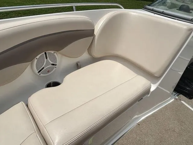 Slide: The Image of 2006 Chaparral 204 SSi boat interior with beige seating and speaker. - 14