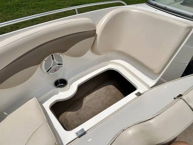 Slide: The Image of 2006 Chaparral 204 SSi boat interior with storage compartment and speaker. - 15