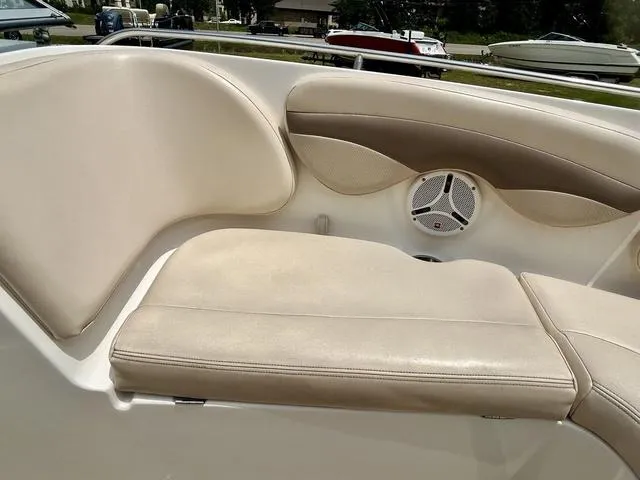 Slide: The Image of 2006 Chaparral 204 SSi boat interior with beige seating and speaker detail. - 16