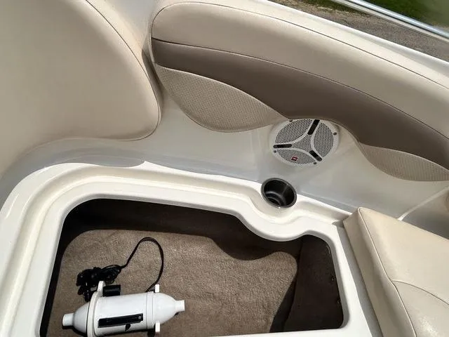 Slide: The Image of 2006 Chaparral 204 SSi boat interior with storage compartment and speaker. - 17