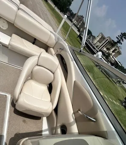 Slide: The Image of 2006 Chaparral 204 SSi boat interior with beige seating and carpet. - 23