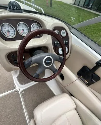 Slide: The Image of 2006 Chaparral 204 SSi boat dashboard with steering wheel and instrument panel. - 25