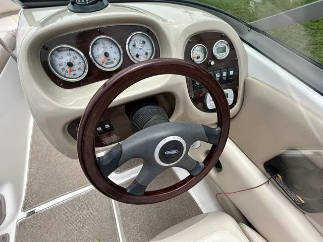 Slide: The Image of 2006 Chaparral 204 SSi boat dashboard with gauges and steering wheel. - 26