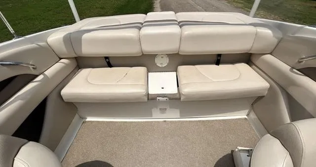 Slide: The Image of 2006 Chaparral 204 SSi boat interior with beige seating and carpeted floor. - 31