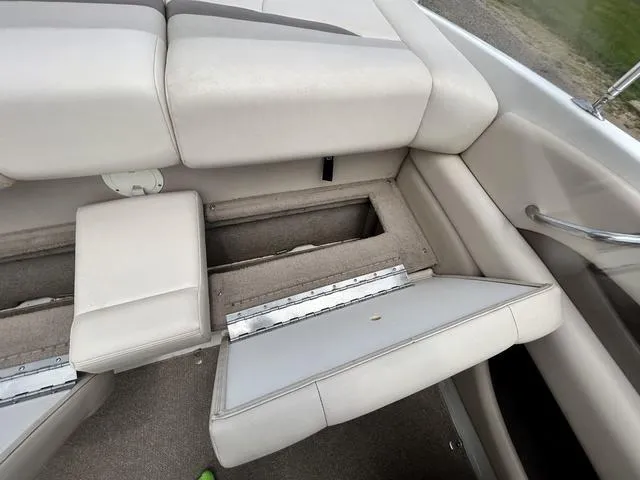 Slide: The Image of 2006 Chaparral 204 SSi boat interior with open storage compartment. - 36