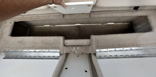 Slide: The Image of Interior storage compartment of a 2006 Chaparral 204 SSi boat, showing carpeted space. - 37