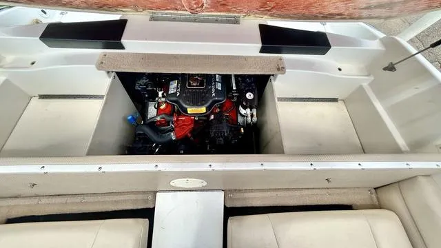 Slide: The Image of 2006 Chaparral 204 SSi boat engine compartment, showcasing a well-maintained motor. - 38