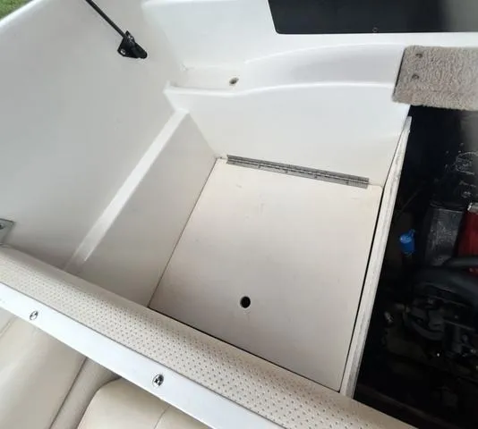 Slide: The Image of 2006 Chaparral 204 SSi boat storage compartment with open hatch. - 39