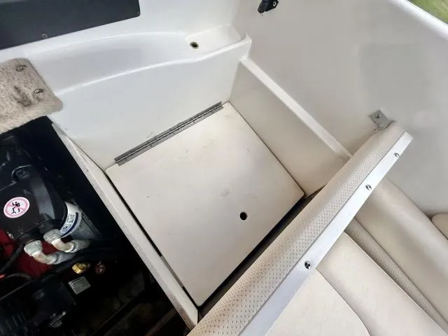 Slide: The Image of 2006 Chaparral 204 SSi boat interior storage compartment with engine view. - 42