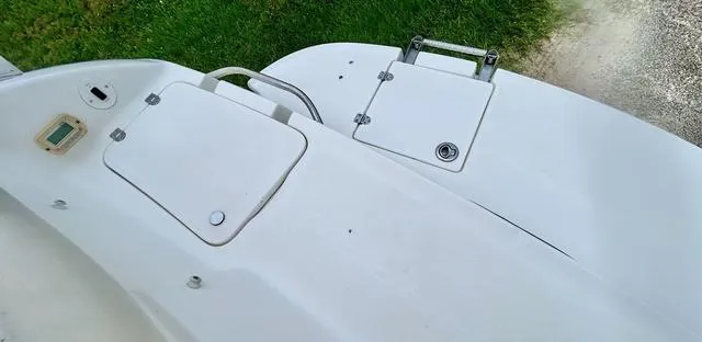 Slide: The Image of 2006 Chaparral 204 SSi boat deck with storage compartments and ladder. - 47