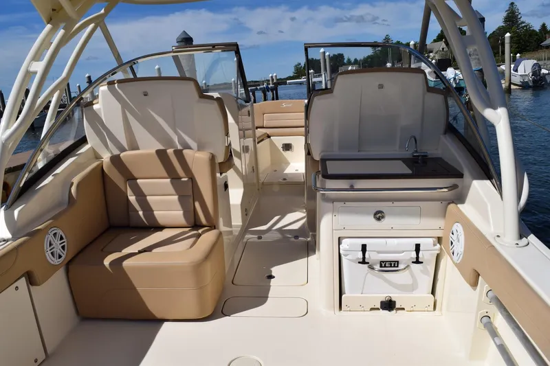 Slide: The Image of 2020 Scout 255 Dorado boat interior with seating and Yeti cooler. - 11