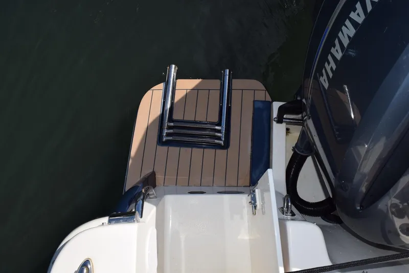 Slide: The Image of 2020 Scout 255 Dorado boat with Yamaha engine and swim platform ladder. - 19
