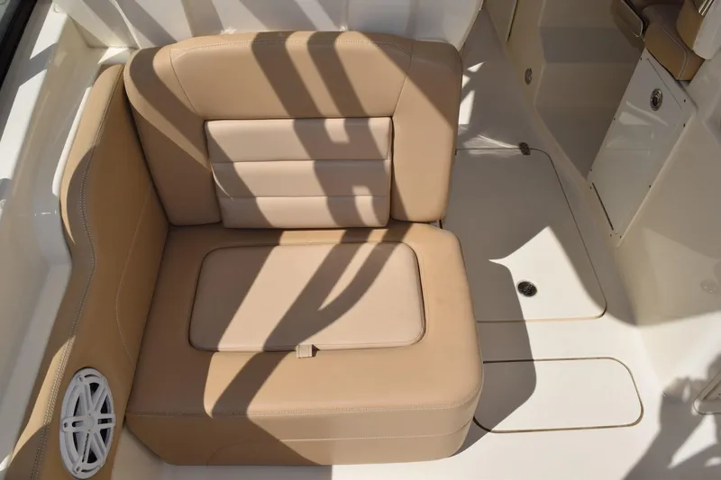 Slide: The Image of 2020 Scout 255 Dorado boat interior with tan seating and speaker. - 6