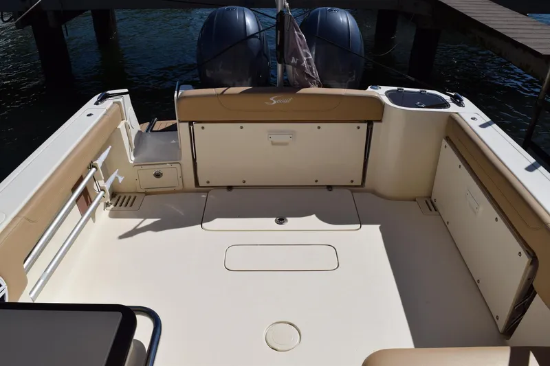 Slide: The Image of 2020 Scout 255 Dorado boat interior with dual engines and spacious seating area. - 7