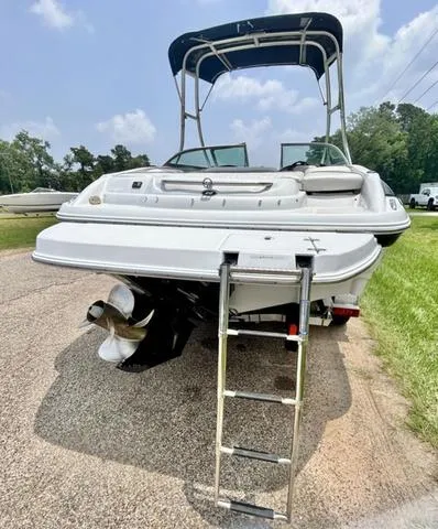 Slide: The Image of 2005 Crownline 216 LS boat with ladder and canopy on a sunny day. - 11