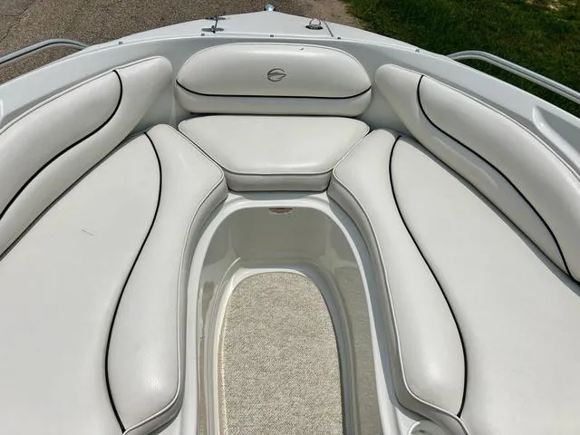 Slide: The Image of 2005 Crownline 216 LS boat interior with white cushioned seating. - 16