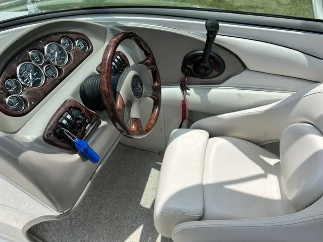 Slide: The Image of 2005 Crownline 216 LS boat interior with steering wheel and dashboard controls. - 26