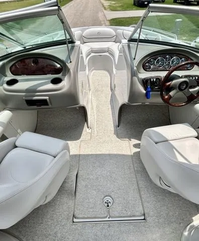 Slide: The Image of 2005 Crownline 216 LS boat interior with plush seating and sleek dashboard design. - 30
