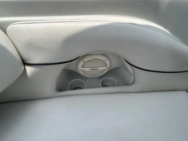 Slide: The Image of Interior of 2005 Crownline 216 LS boat with speaker and cup holders. - 34