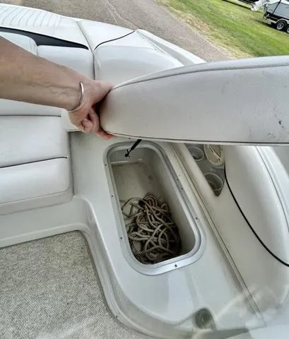 Slide: The Image of 2005 Crownline 216 LS boat storage compartment with rope inside. - 35
