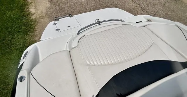 Slide: The Image of 2005 Crownline 216 LS boat with white seating and deck, viewed from above. - 42