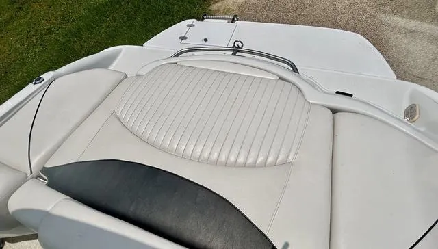 Slide: The Image of 2005 Crownline 216 LS boat with white leather seating and sleek design. - 43