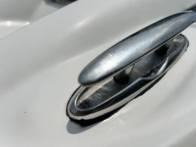Slide: The Image of Close-up of a 2005 Crownline 216 LS boat cleat on a white surface. - 45